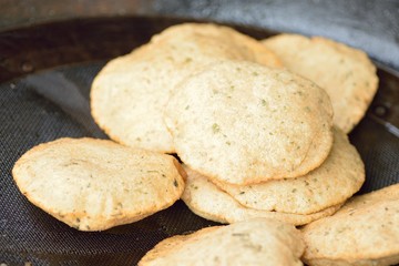 Indian popular snacks food Kachauri being fried at street side shop in Varanasi, India