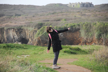 woman traveling alone in the french Brittany in winter season and having good time