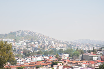 Fototapeta na wymiar Aerial view of Mexico City skyline and rooftops in Satélite.