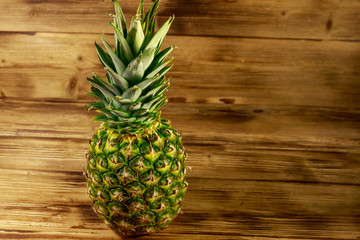 Whole pineapple on wooden table