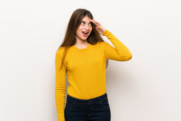 Young woman with yellow sweater has just realized something and has intending the solution