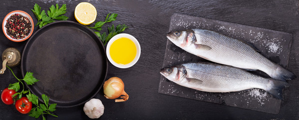 fresh fish with  ingredients for cooking, top view