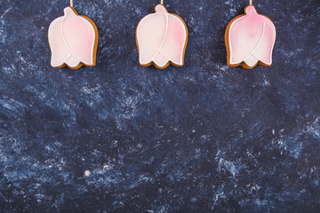 Gingerbread cookies in the shape tulips  with copy space. Top view. Flat lay
