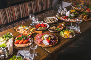 Appetizers table. Variety of food. Family party table.
