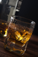 Alcohol drink with ice in  a glass. Closeup