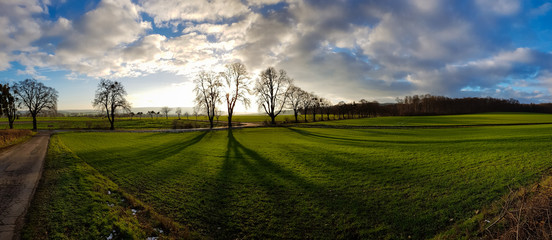 Panorama of a beautiful, colorful, fantasy, unrealistic landscape during sunset in the winter