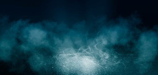 Black background of empty street, room, blue searchlight illuminates asphalt, smoke © Laura Сrazy