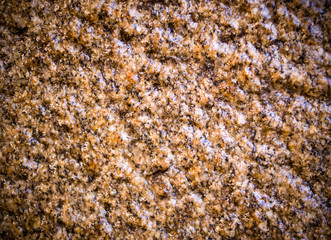wet beige cave granite wall texture with vignette. background, geological.