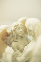 Fototapeta na wymiar couple of angels archangel in romantic embrace like love, peace, guardin angel and religion concept