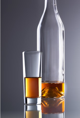 glass and bottle of whiskey