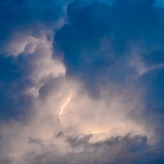 Lightnings in storm clouds. Peals of a thunder and the sparkling