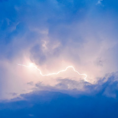 Lightnings in storm clouds. Peals of a thunder and the sparkling