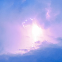 Lightnings in storm clouds. Peals of a thunder and the sparkling