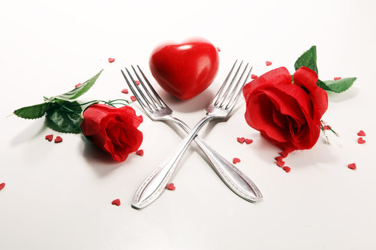 Festive table setting for Valentine's Day with forks and hearts