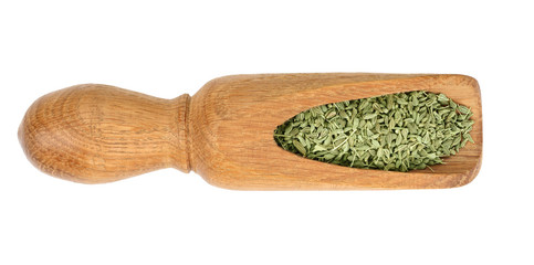 Cumin or caraway seeds in wooden scoop isolated on white background. Top view