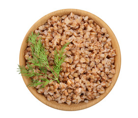 Buckwheat porridge in wooden bowl isolated on white background. Top view