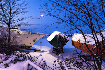 Covered sailing boats at the dockyard