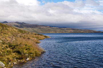 Lake in the prairies of the interior of southern Norway on a cloudy day.