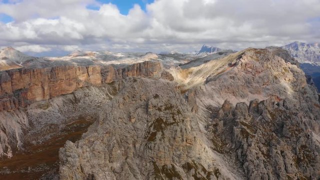 Aerial view of the Paso Gardena Pass in the province of Bolzano. Dolomites. Flying near the Pizes de Cir. In the distant view of a mountain Schelrn. Autumn in Italy