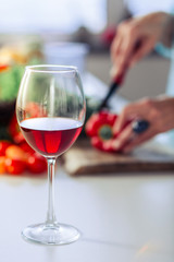 Selective focus of a glass with red wine
