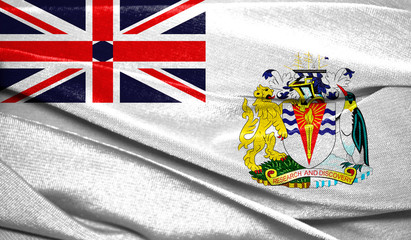 Realistic flag of British Antarctic Territory on the wavy surface of fabric. Perfect for background or texture purposes