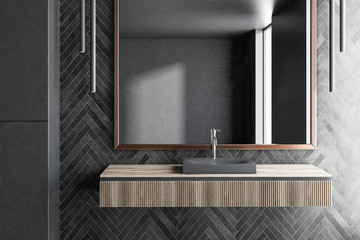 Black wooden bathroom, sink close up