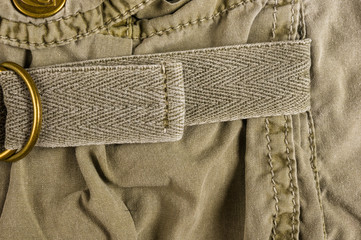 clothing items washed cotton fabric texture with seams, clasps, buttons and rivets