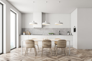 Naklejka na ściany i meble White kitchen with wooden table