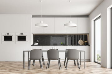 White kitchen interior with table