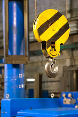 Close up hook crane of overhead crane in factory, machine part concept