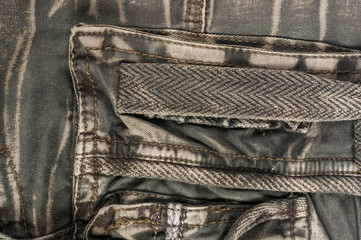 clothing items washed cotton fabric texture with seams, clasps, buttons and rivets