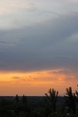 Obraz premium Landscape with dramatic light - beautiful golden sunset with saturated sky and clouds.