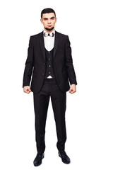 Serious strict businessman or boss in a black suit in full growth