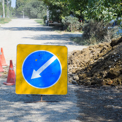 Sign of detour travel. Pit on the road. repair work.