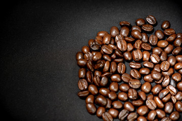 Coffee bean on black table in coffee shop. Selective focus.