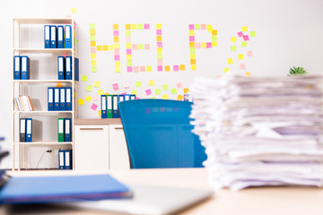 Young employee suffering from excessive work  