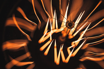 Tungsten lamp glowing over dark background