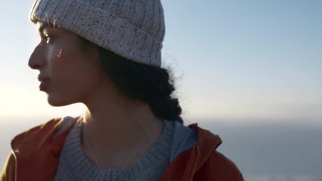 Girl looking away standing outdoors on winter day