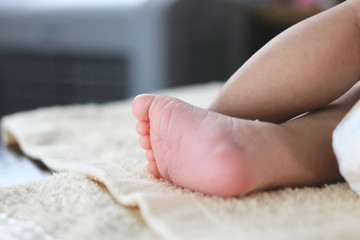 Obraz na płótnie Canvas Soft focus of newborn tiny baby feet with copy space background.