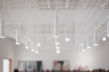 Decorative modern lights bulb in a white room,