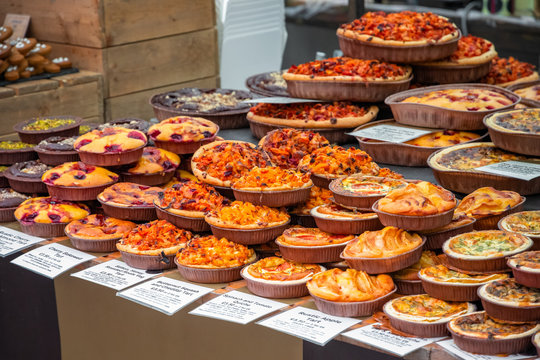 Assortment of tarts and quiches on display at Broadway Market in Hackney, East London