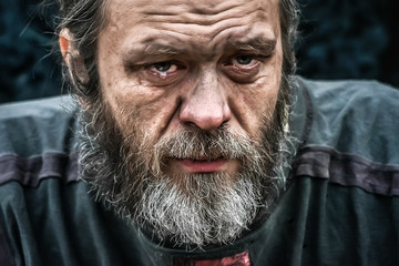 Homeless man crying portrait closeup