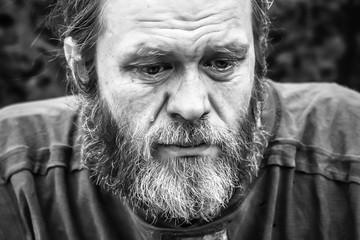 Homeless man crying portrait closeup