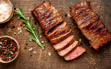 Beef steak on the cutting board with spices