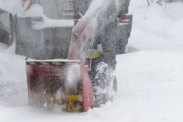Snow removing with a snow blower