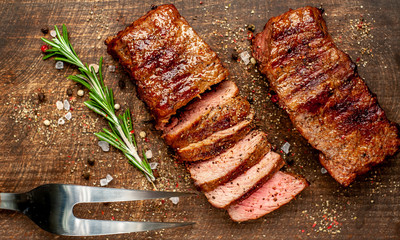 Beef steak on the cutting board with spices