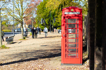 London red phone booth in a park