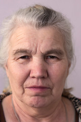 serious woman with gray hair on her head