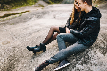 Love is in the air. Beautiful young couple embracing and smiling outdoors