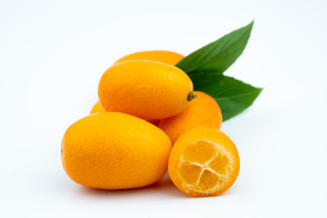 Ripe kumquats on white background